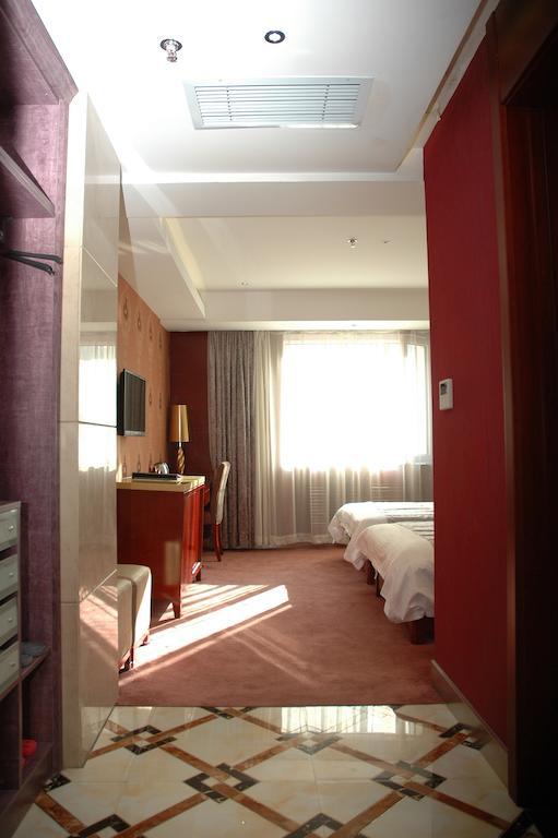 Harbin Yakelai Holiday Hotel Phòng bức ảnh