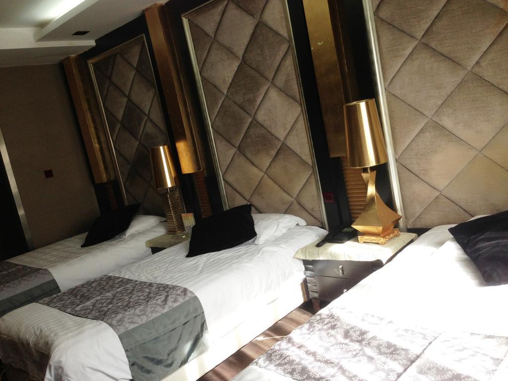 Harbin Yakelai Holiday Hotel Phòng bức ảnh